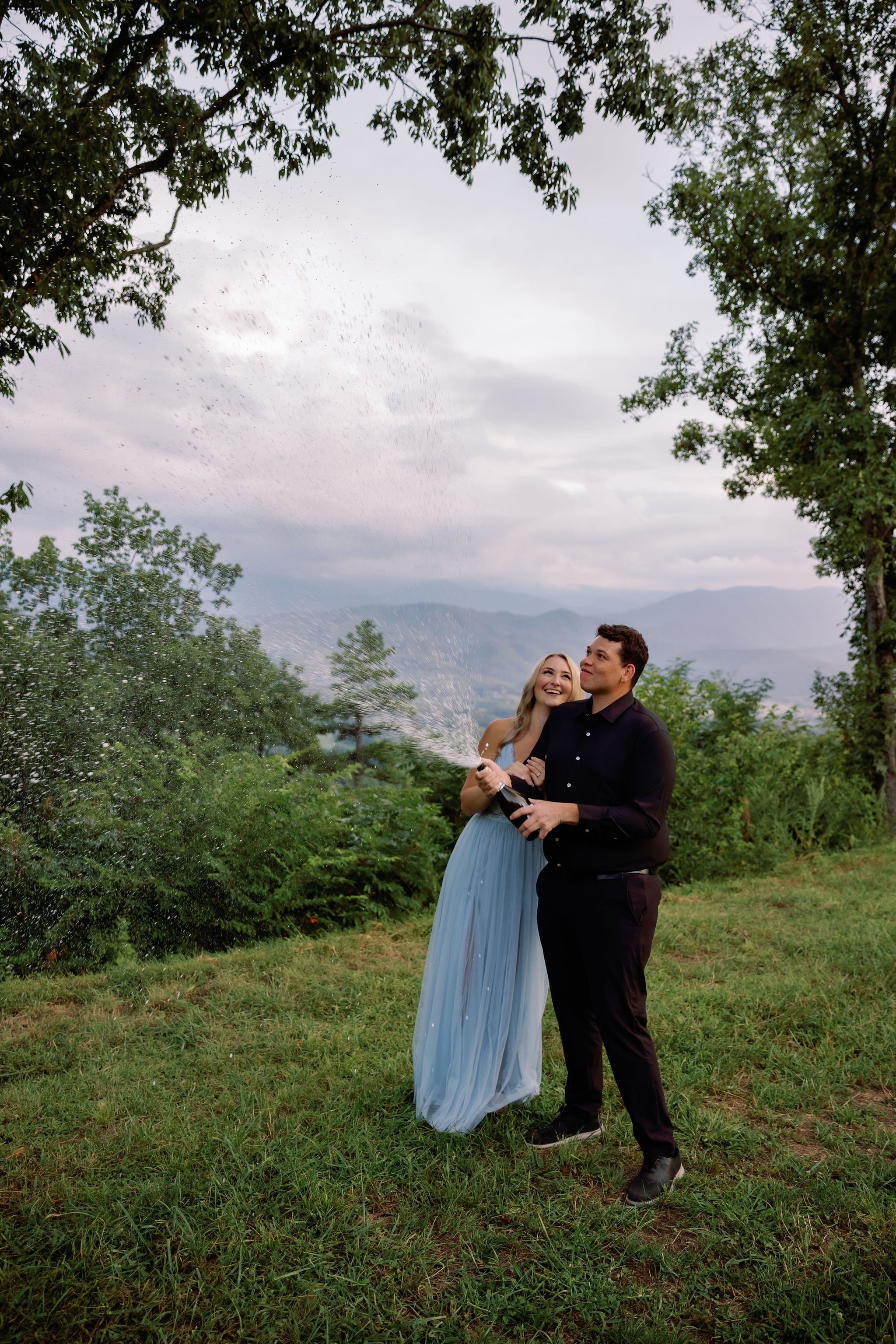 Engagement-Photo-Poses-With-Gatlinburg-Photographer-champagne-pop