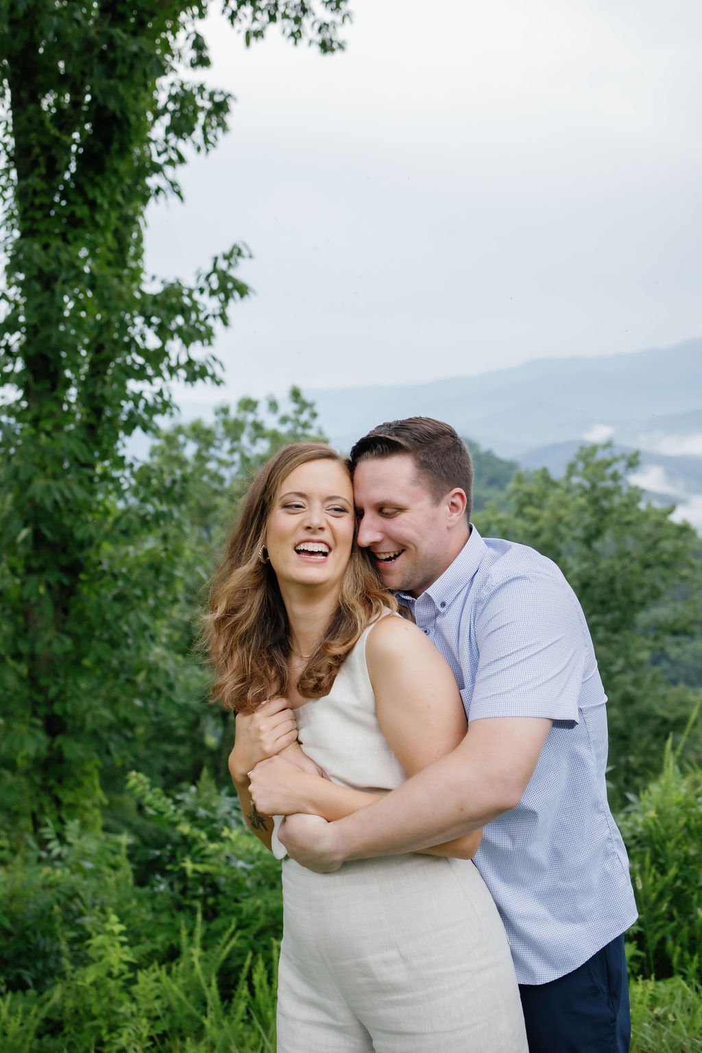 gatlinburg-photographer-smoky-mountain-engagement-photos-man-hugging-woman