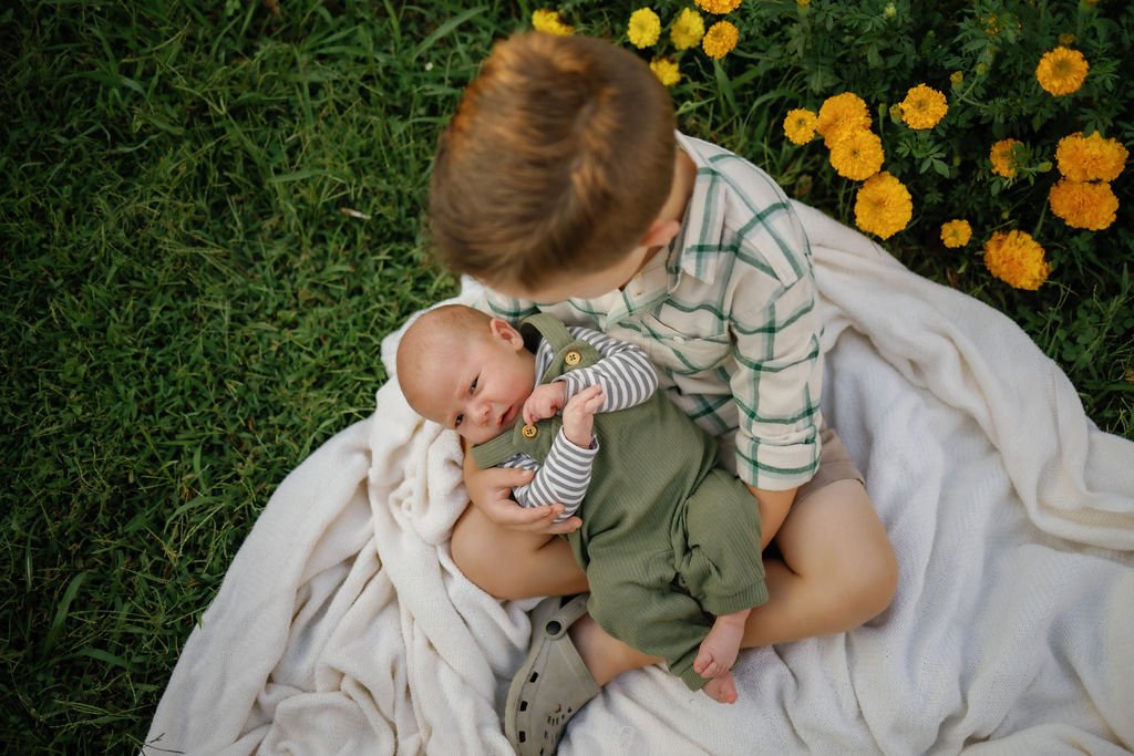 gatlinburg-photographers-widflower-photos-with-gatlinburg-photographer-brother-holding-baby