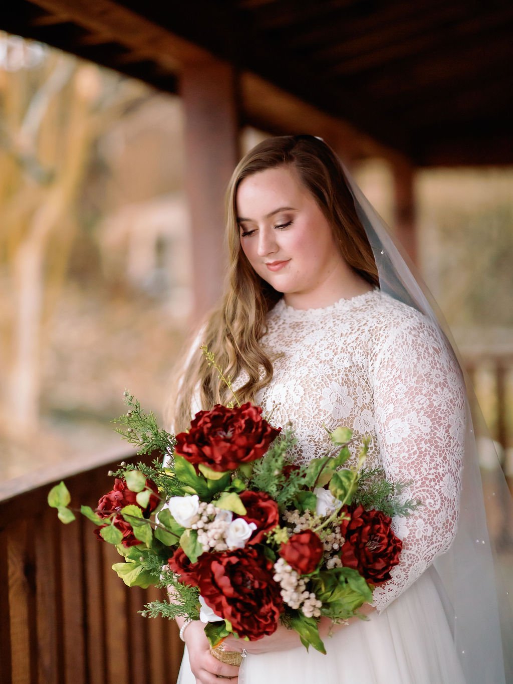 gatlinburg-photographer-what-happens-if-it-rains-on-your-gatlinburg-wedding-bride-holding-red-bridal-bouquet