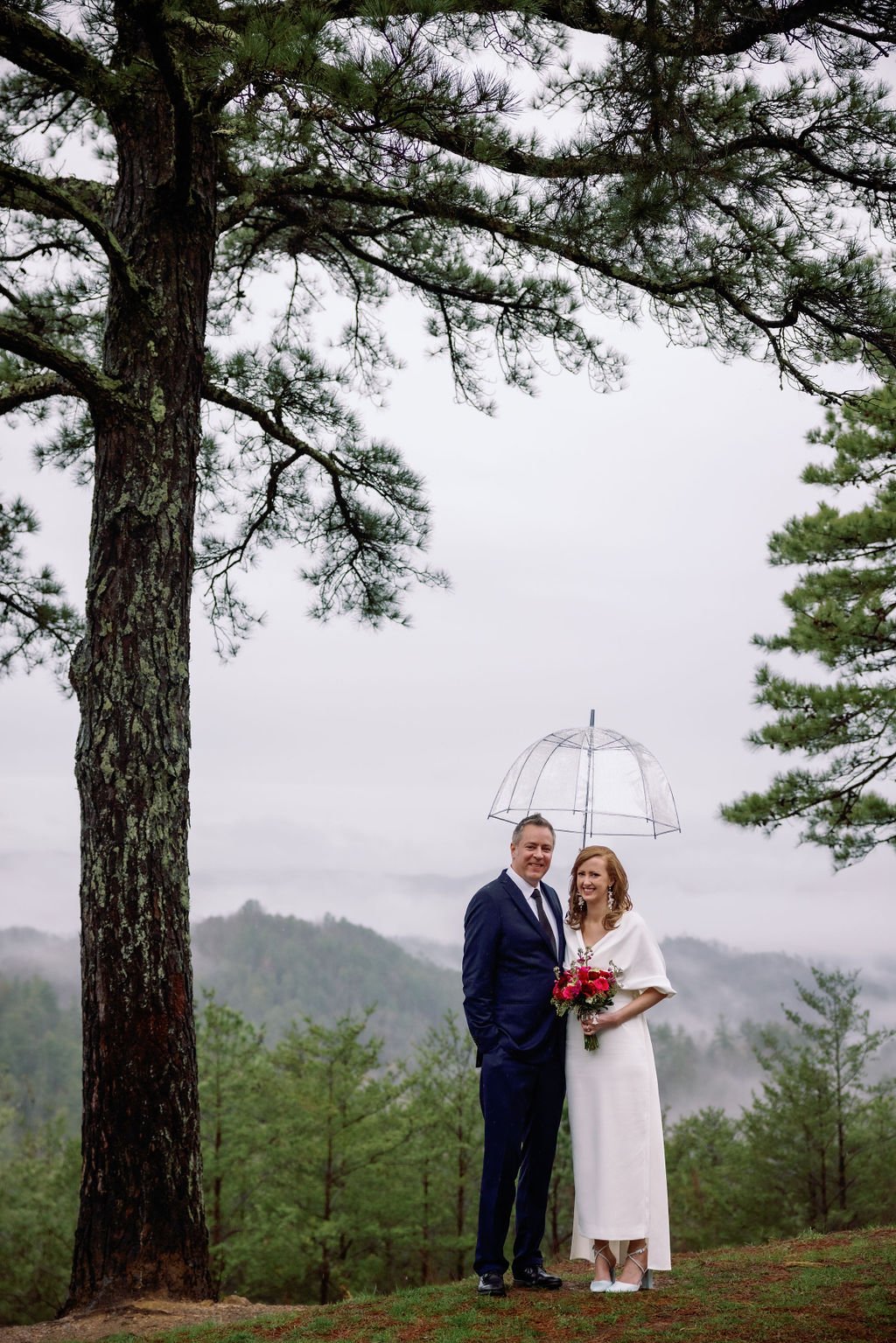 gatlinburg-photographers-gatlinburg-wedding-packages-for-two-couple-under-umbrella