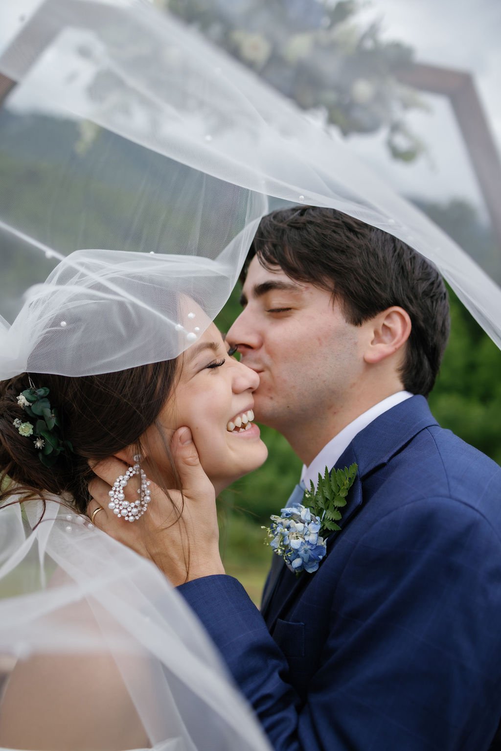 gatlinburg-photographer-mountain-mist-farms-wedding-venue-bride-groom-veil