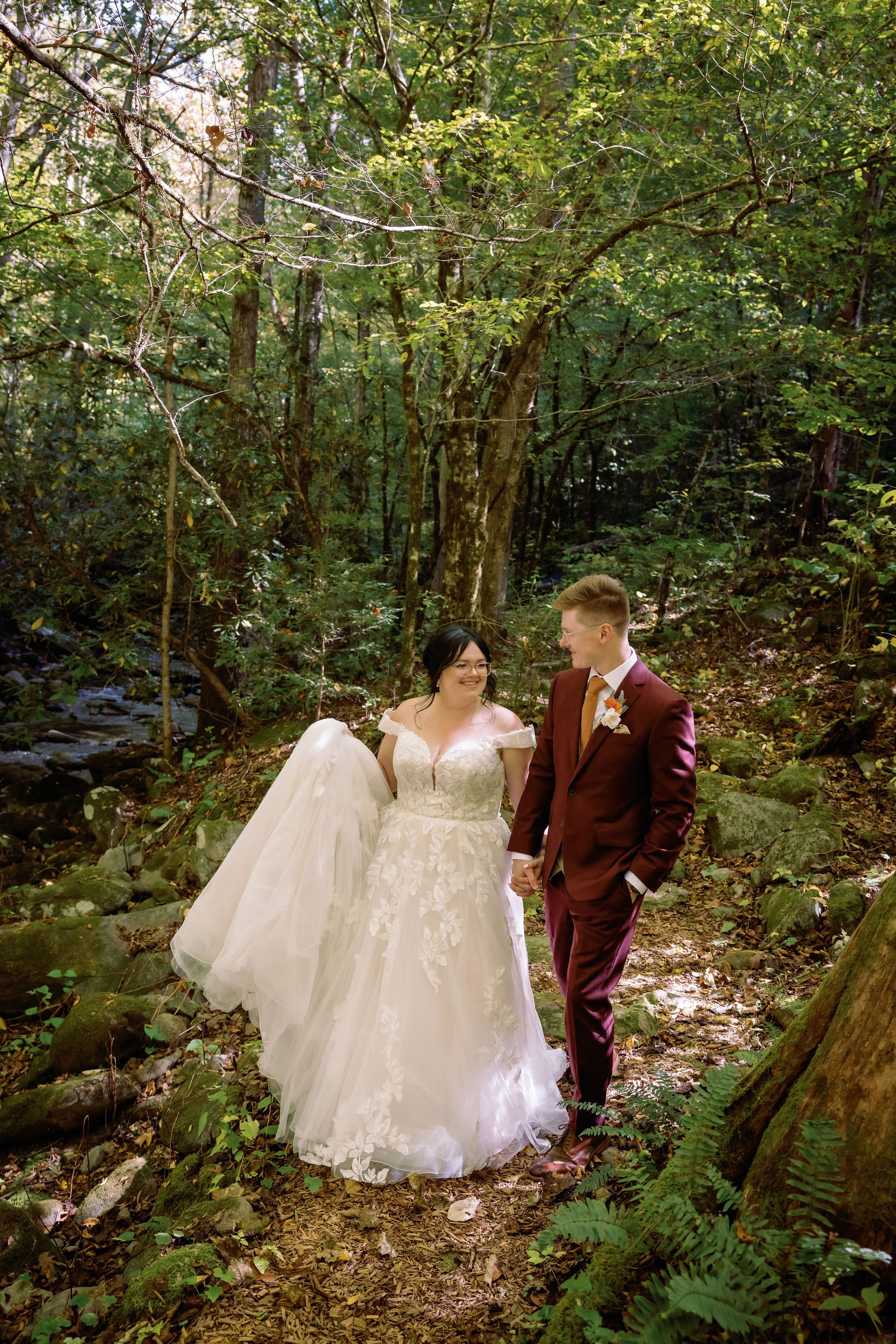 gatlinburg-photographer-6-myths-about-eloping-bride-groom-walking-through-forest