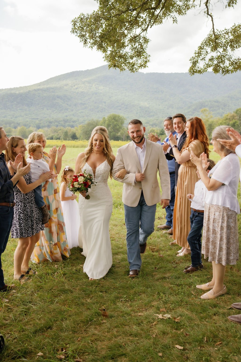 gatlinburg-photographer-6-myths-about-eloping-bride-groom-walking-with-family-celebrating-them