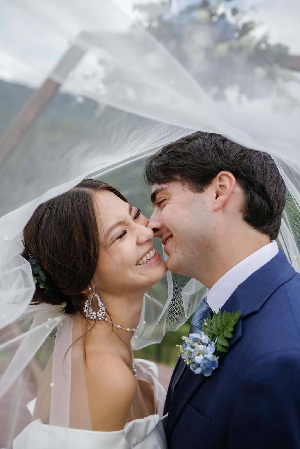 gatlinburg-photographer-6-myths-about-eloping-couple-laughing-together-under-veil