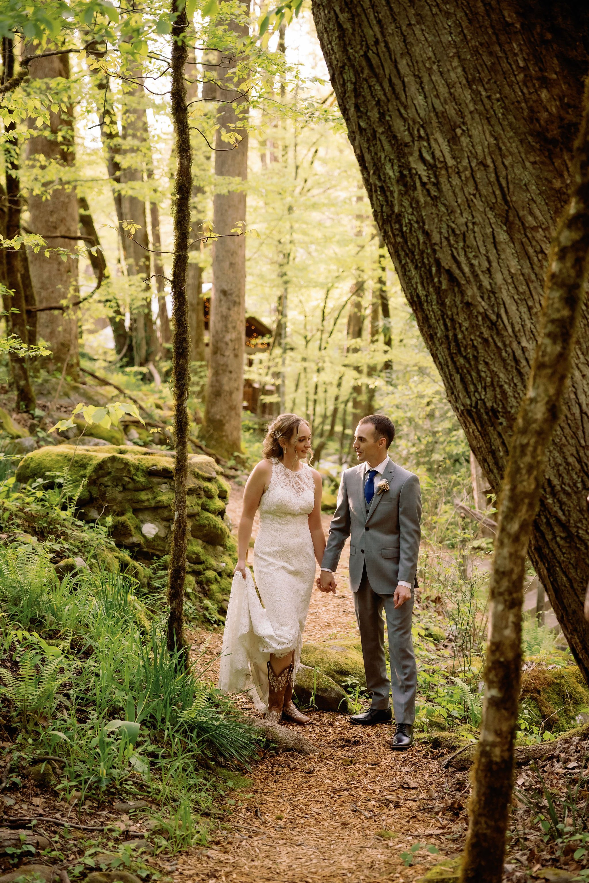 gatlinburg-photographer-6-myths-about-eloping-couple-walking-through-forest
