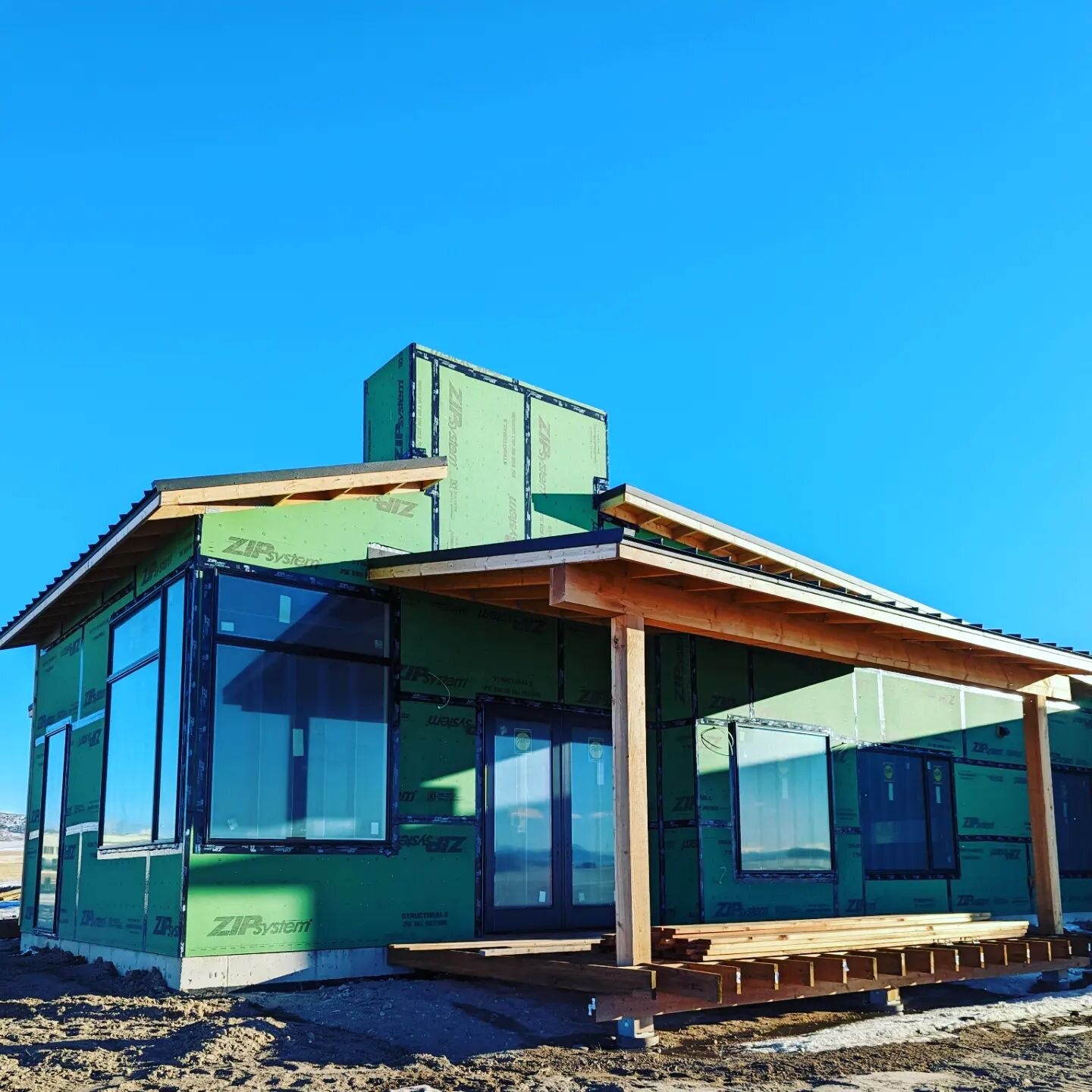 Progress on this beautiful house in the landscape is heading into wood siding install and boxed metal window trims.  Zip system and pella windows provide the envelope behind the finish system, and furring is used to create a breathable air gap for a 