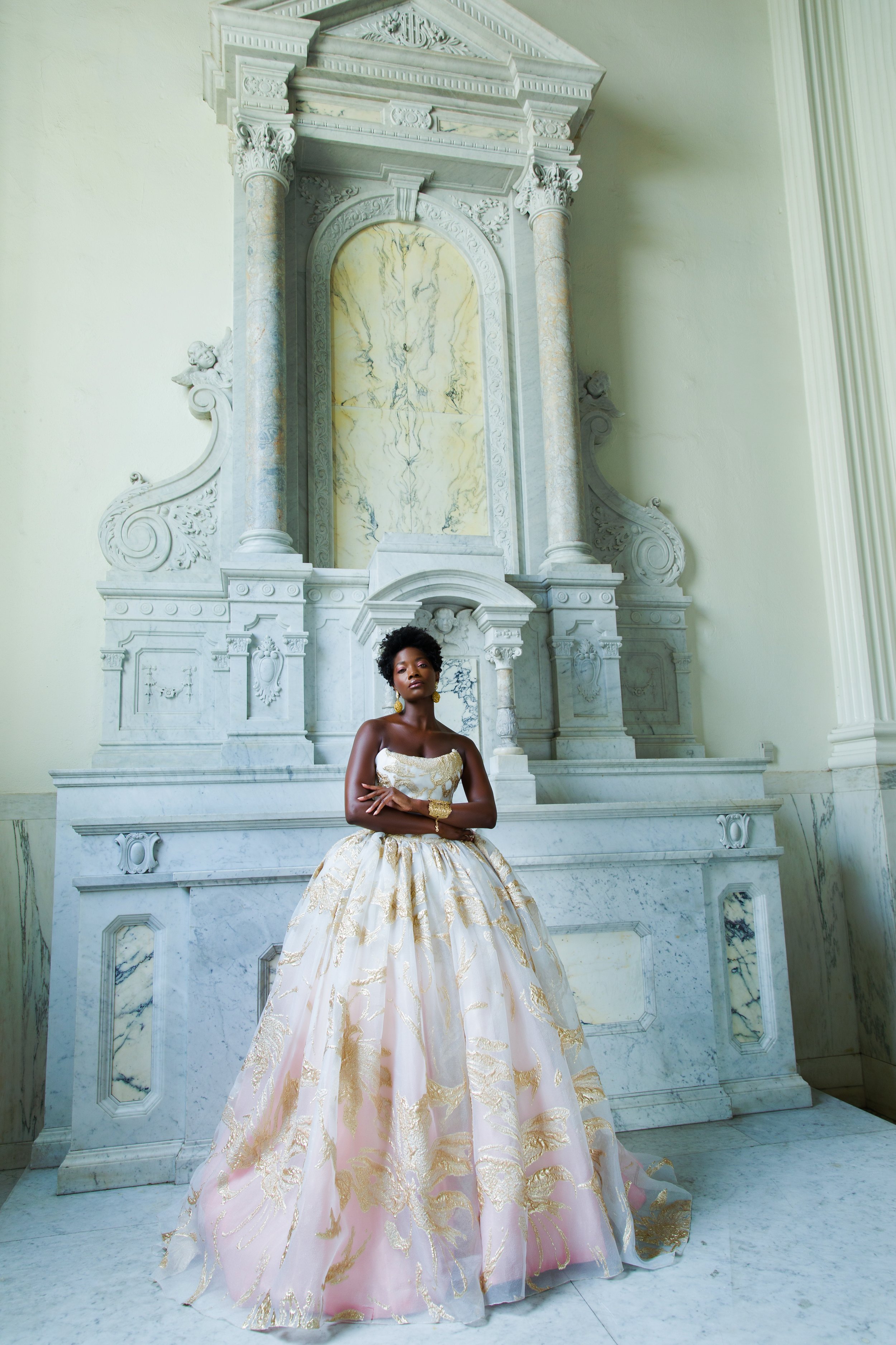  The Off-White and Pink Ball Gown Dress is designed in an off white gazer with bold gold lamé flowers, lined in off white and pink ombre silk taffeta. This look is finished with a&nbsp;vintage&nbsp;drop gold earrings and a gold sculptured cuff. 