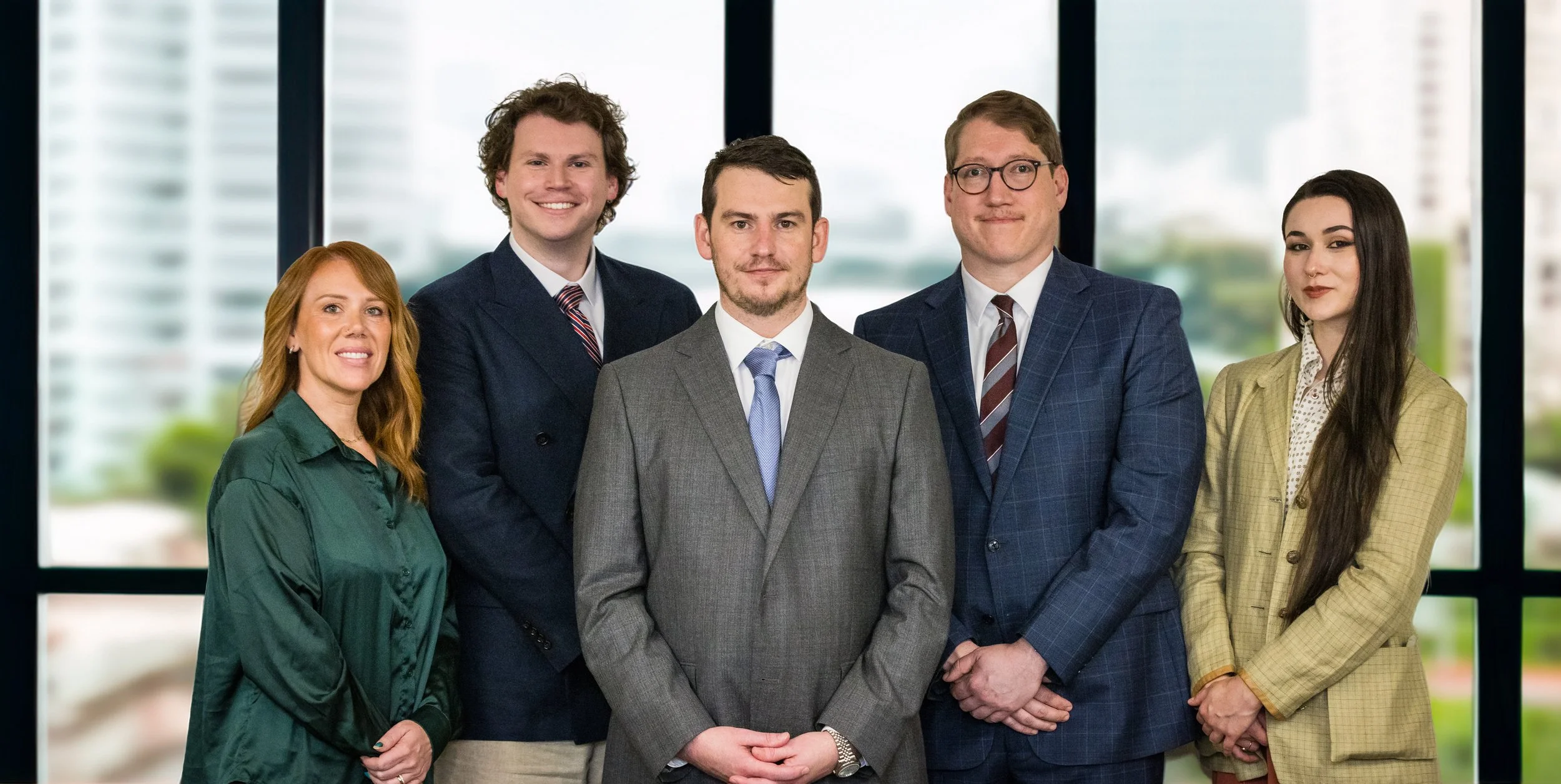 The corporate team of three men and two women from Meadows Law posing together indoors for a professional brand photography session in Pittsburgh by VAMP Media.