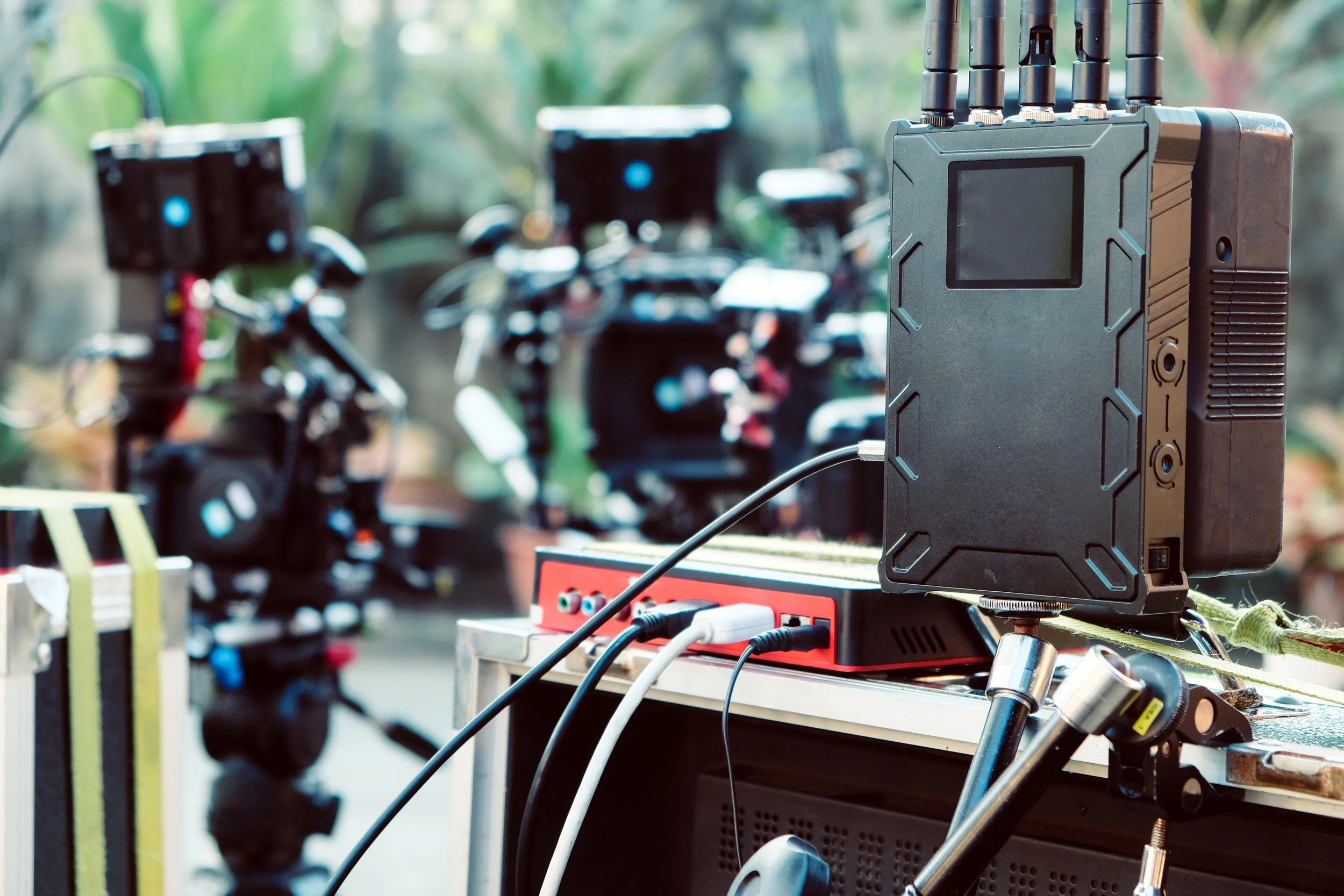 High-end wireless video transmission equipment and live streaming gear set up on location for an event.