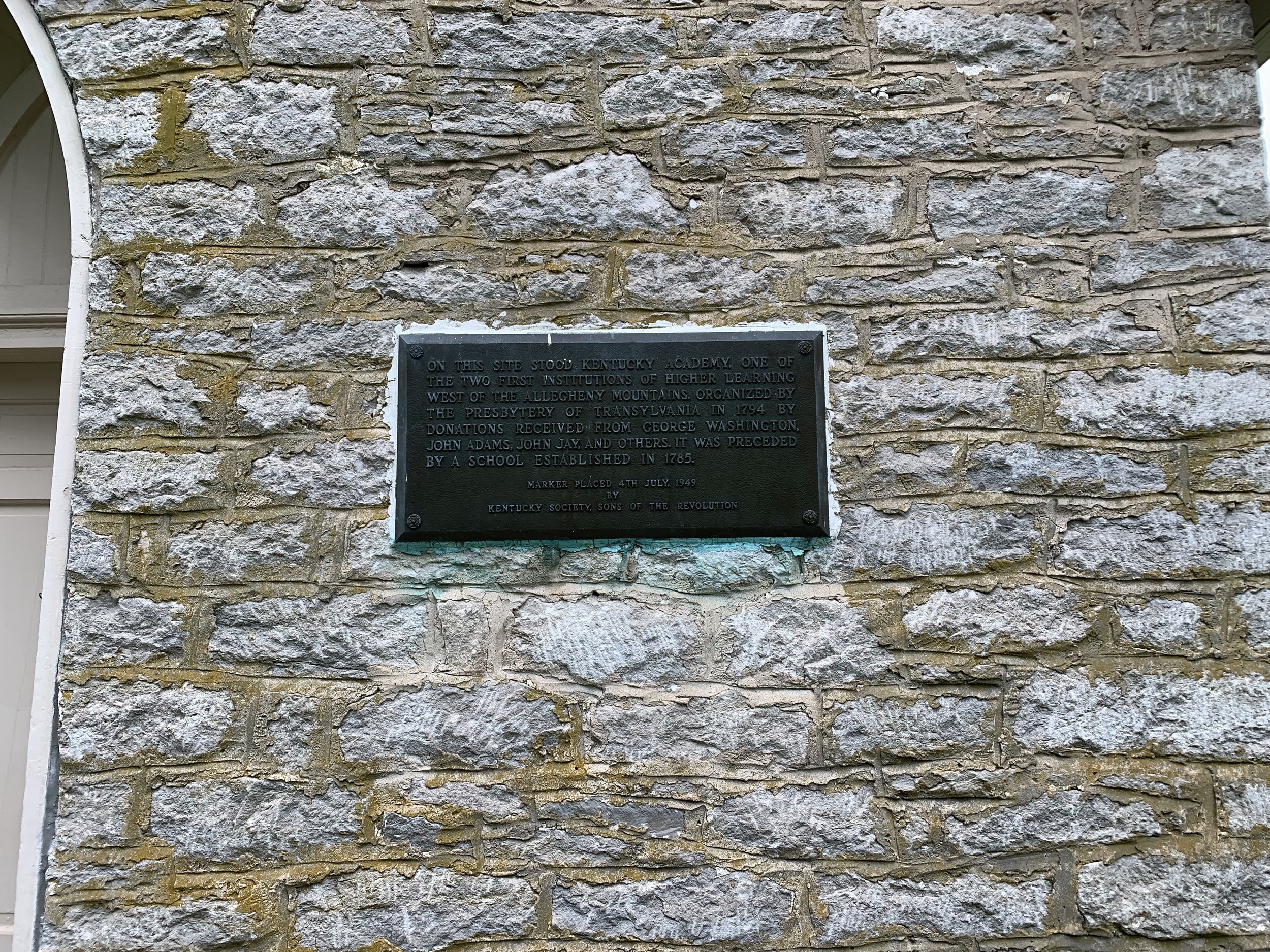 Plaque Honoring a Former School on the Site