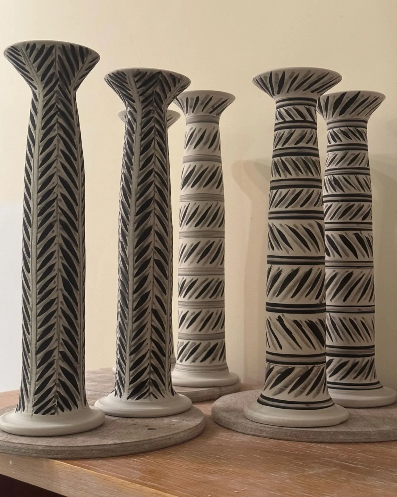 Unfired candlesticks sitting on a workshop shelf. They are fired now, out and about, and the workshop is empty and chilly &hellip; 

#emptyshelves
#winterworkshop
#yuletide