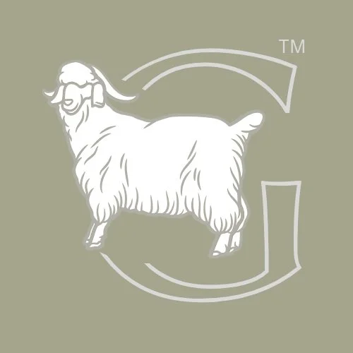 A logo of a goat wearing glasses, with stylized lines and a TM symbol.