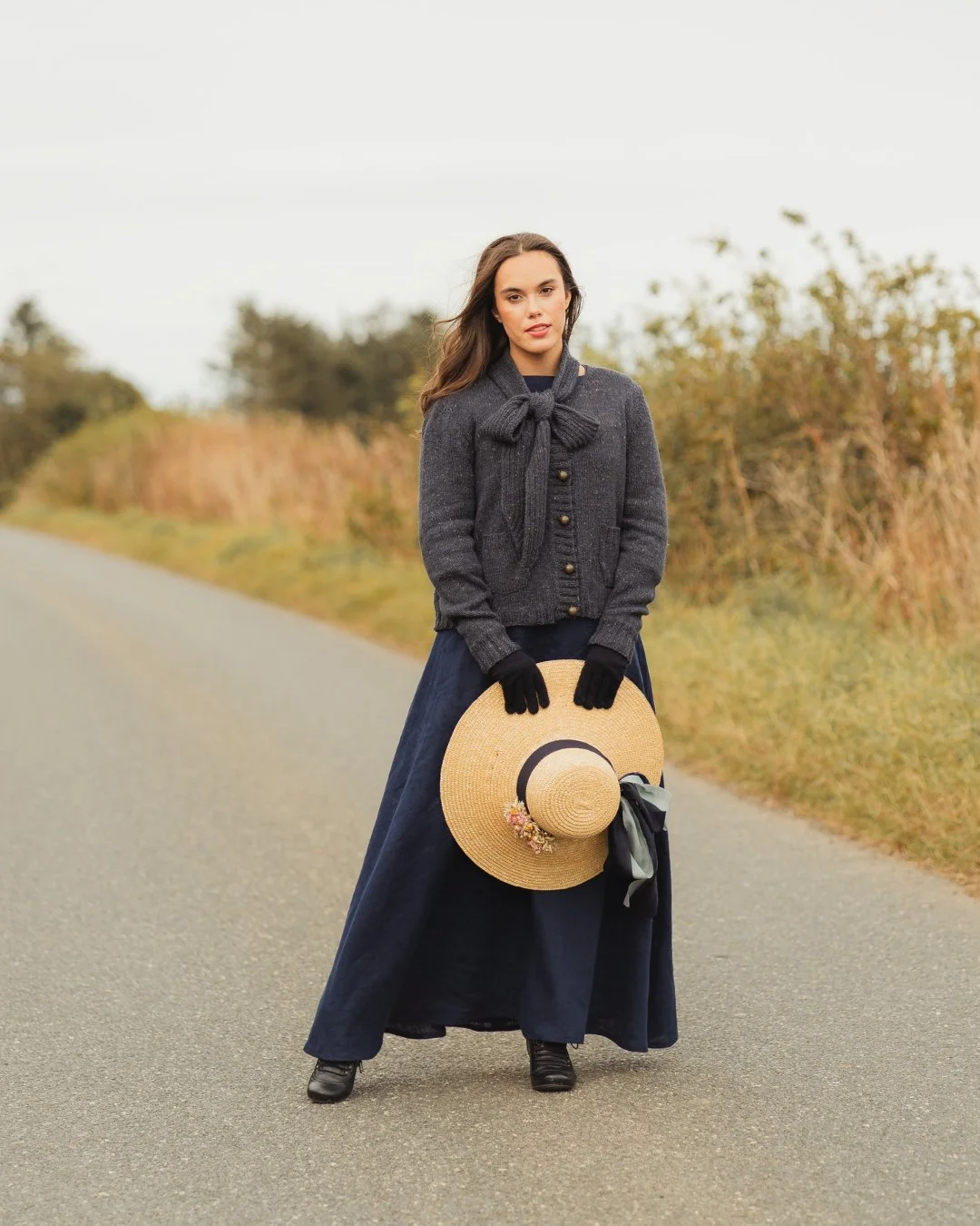 There&rsquo;s a chill in the air on the hillside, but it&rsquo;s not quite coat weather yet.

The perfect moment for our hand-knitted Norland Bow Jacket, paired with our Bront&euml; lined linen dress and our our handmade straw hat &mdash; a little su
