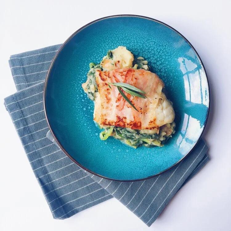 Schelvis in een jasje van spek en spinaziepuree