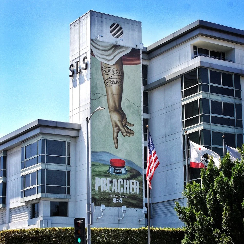 amc-preacher-hand-red-button-on-building.jpg