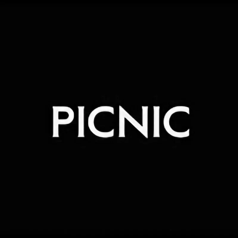 Black background with the word 'PICNIC' in white capital letters