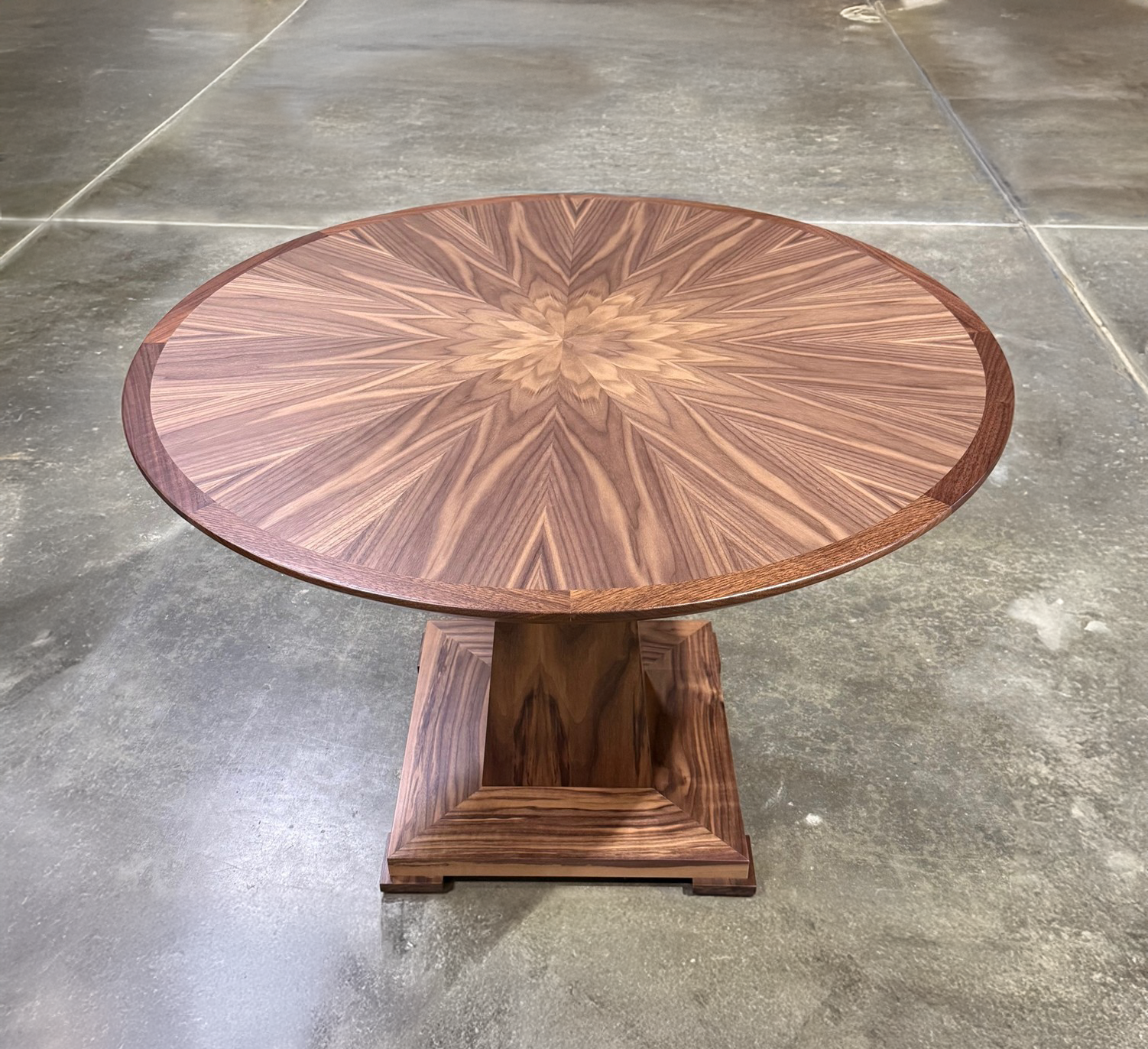 42" ROUND HUXLEY TABLE WITH CUSTOM WALNUT VENEER STARBURST TOP AND SOLID WALNUT BASE