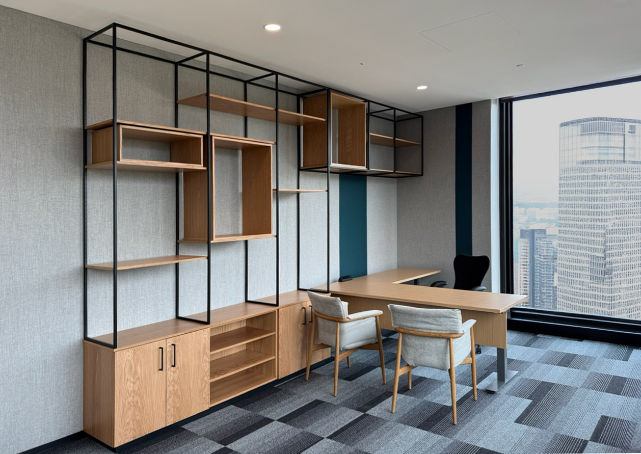 WHITE OAK BUILT IN CABINETS AND SHELVING WITH METAL FRAMING AND ADJUSTABLE HEIGHT DESK