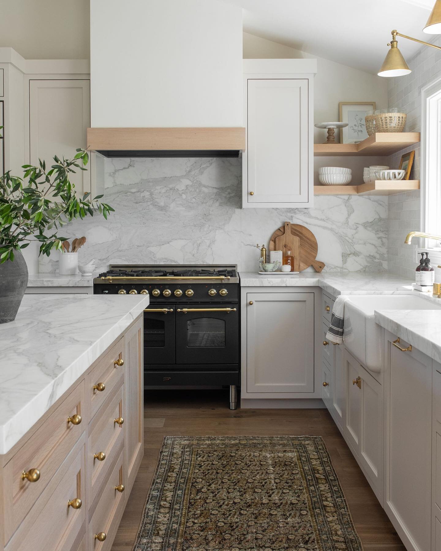 We can&rsquo;t get enough of this dreamy kitchen from our #surreyfarms project! This open-concept features coordinated marble countertops and backsplash. With the addition of wooden elements and a stand-out kitchen stove, this space is both beautiful