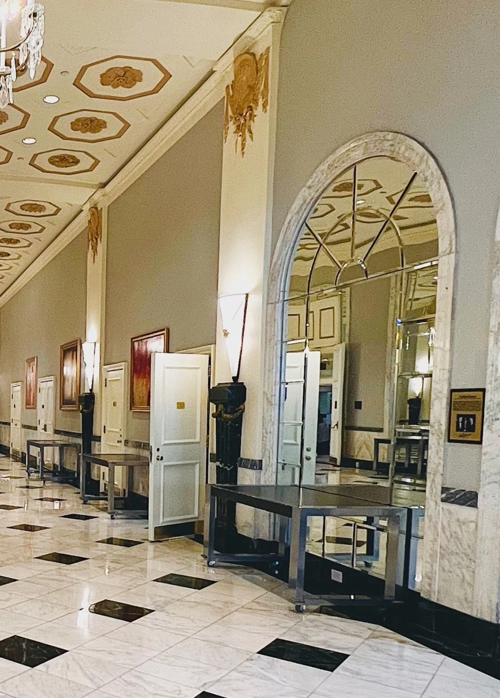 Arches in the north wall gave access to meeting rooms. The arches leading to the Grand Ballroom, Chinese Room, and the original Presidential Room were topped with sculpted architraves of white Alabama marble, while the other arches were each topped b