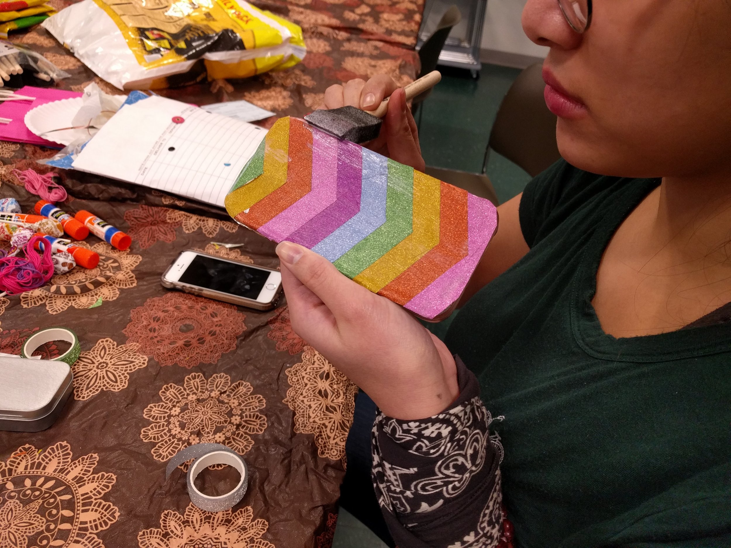 At this LITT-supported Teen Teach Teens craft session in Randolph, a local teen taught her peers to make jazzy beaded phone covers.