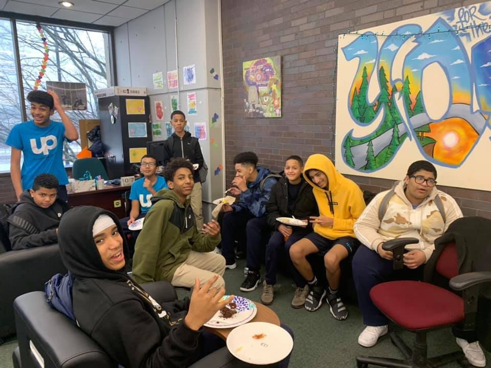 Hanging out over pizza in the new, welcoming Teen Corner at Lawrence Public Library.