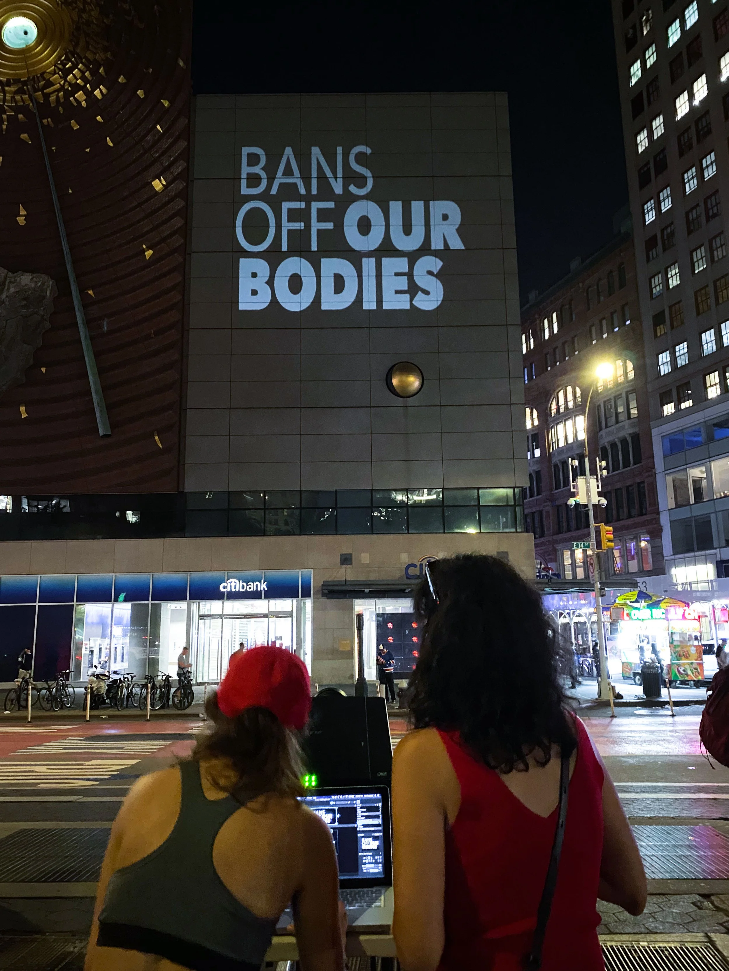 Light projection in Union Square that reads "Bans Off Our Bodies"
