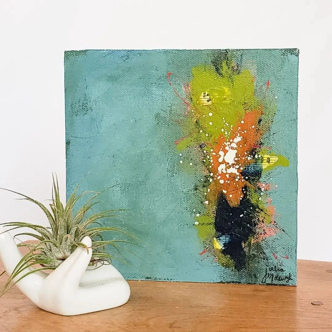 Product Highlight: Energy Abstract

The colors in this artwork were inspired by the Lake Michigan shore. I love to play with line, shape, texture, and color to create dynamic compositions. I use sheet music in my collage pieces because of my love for