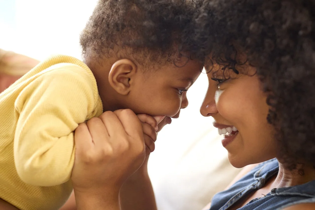 mom and baby face to face during Buttonloop Children’s Therapies infant services
