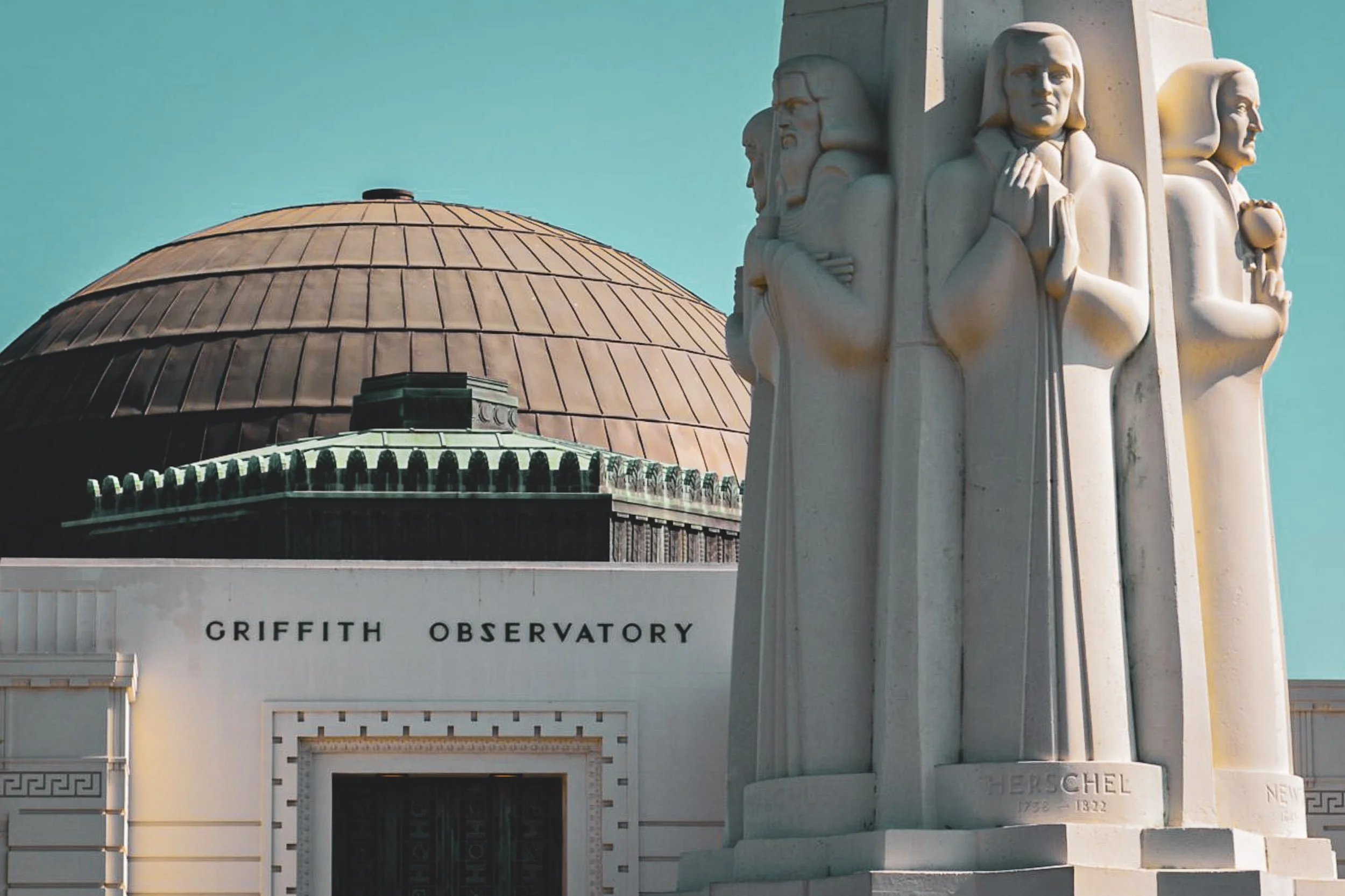 Griffith Observatory Monument - The clean, elegant Art Deco stone lines of the monument outside the Griffith Observatory, set against a crisp sky.