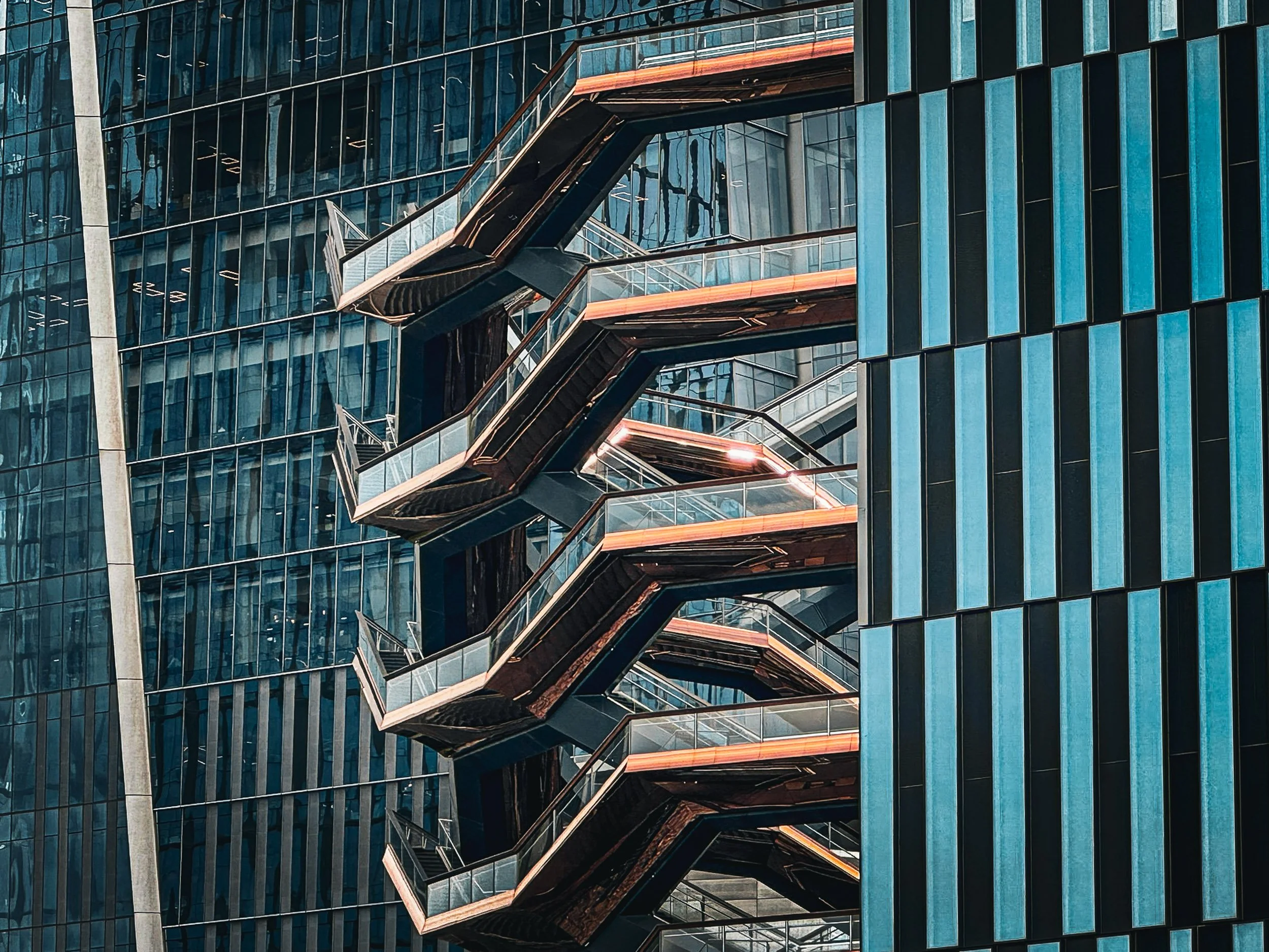 Symmetrical Exterior of The Vessel - A perfectly centered, dizzying vertical perspective capturing the repeating, interlocking geometric honeycomb exterior structures of The Vessel.