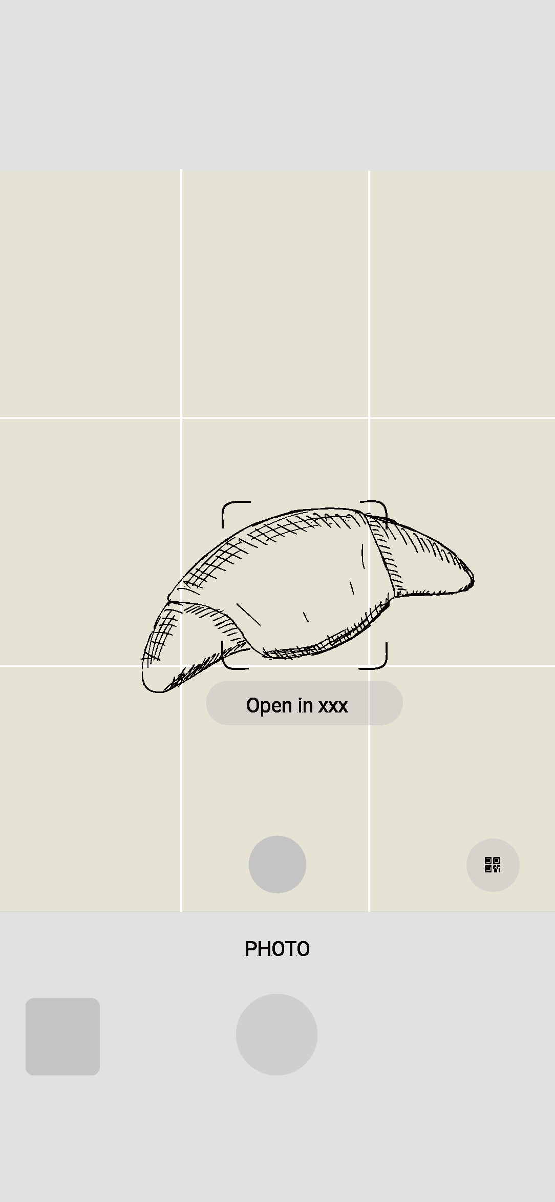 Sketch of a closed hand with a caption that reads 'Open in xxx' and a photo icon below it.