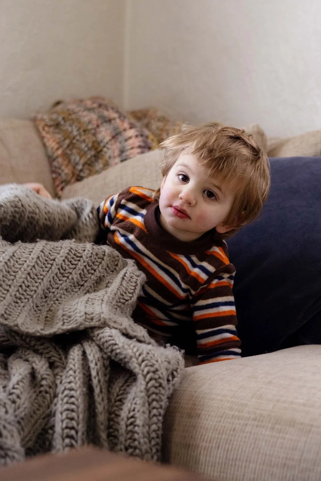Little boy on the family couch