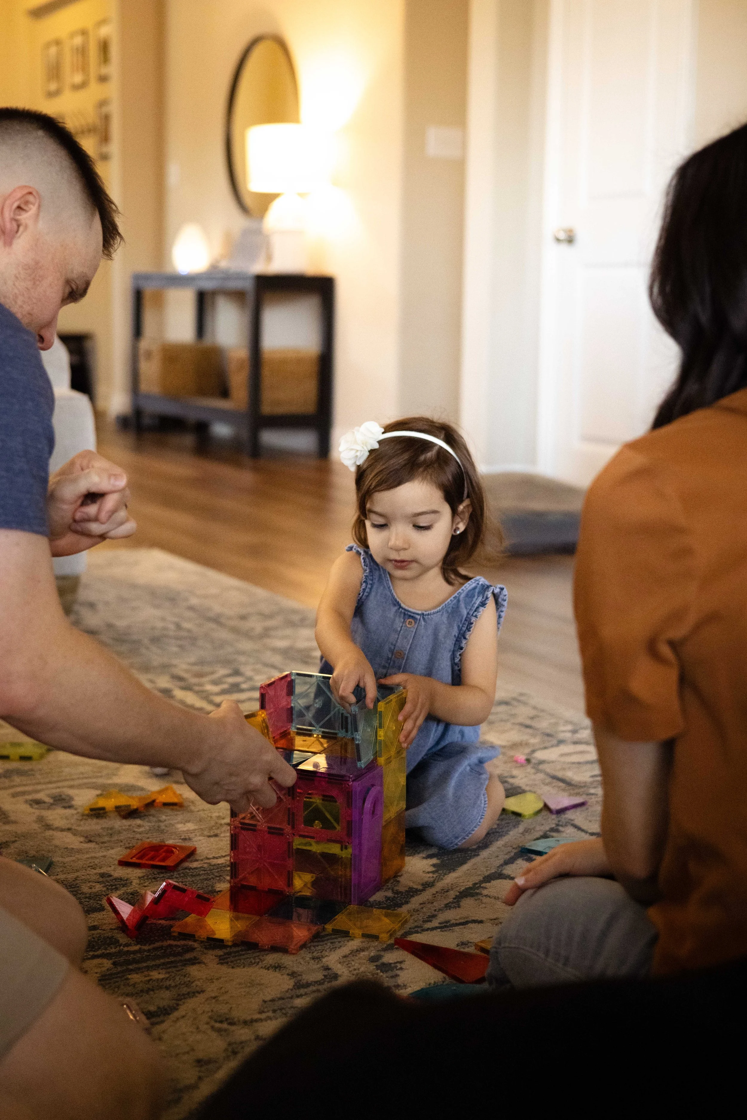Candid family playing with toys together