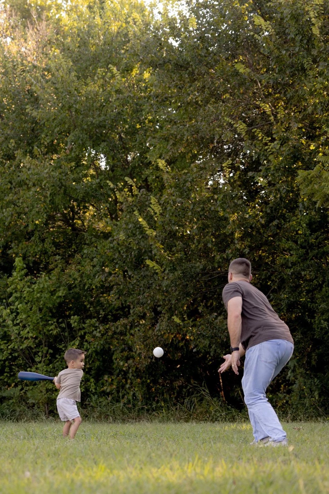 Father and son backyard baseball