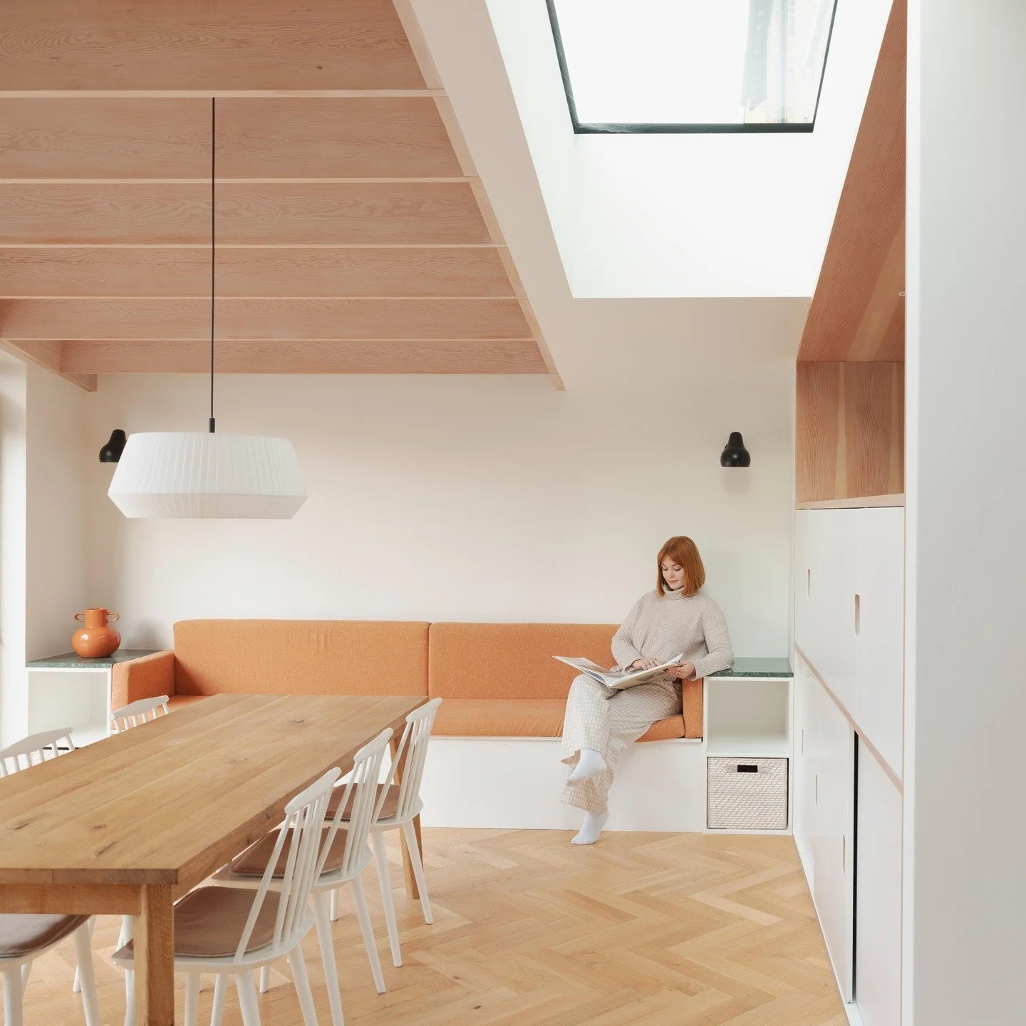 Inside Hilly Fields Crescent a feature up and over window brings natural daylight into the heart of the kitchen space, with a full length strip roof light positioned in the sloping green roof which defines the social space. 

To perceptively enhance 