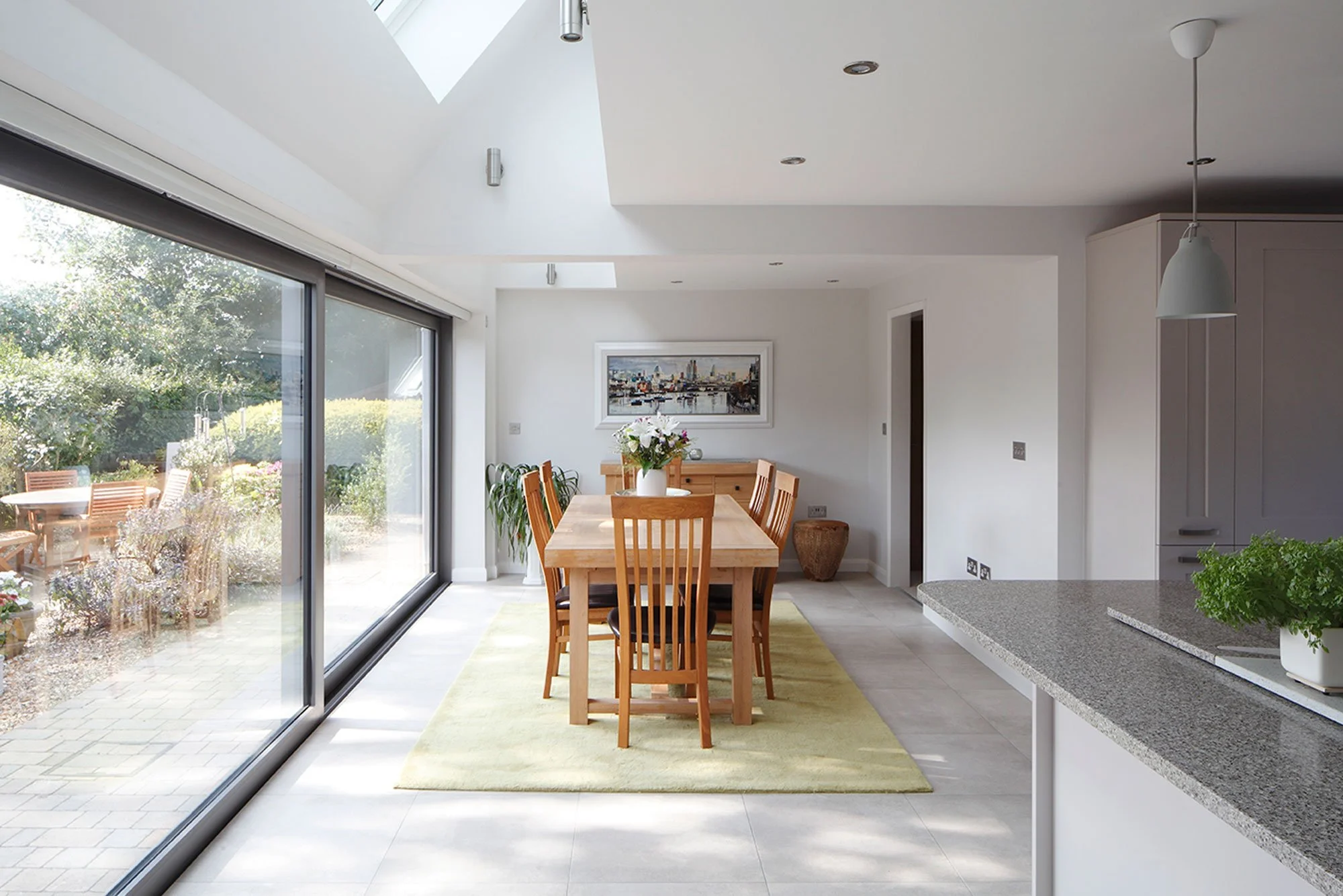 Rear and side extension dining area with sliding glass doors - Marjoram Architects 9 Down Barn Close Project