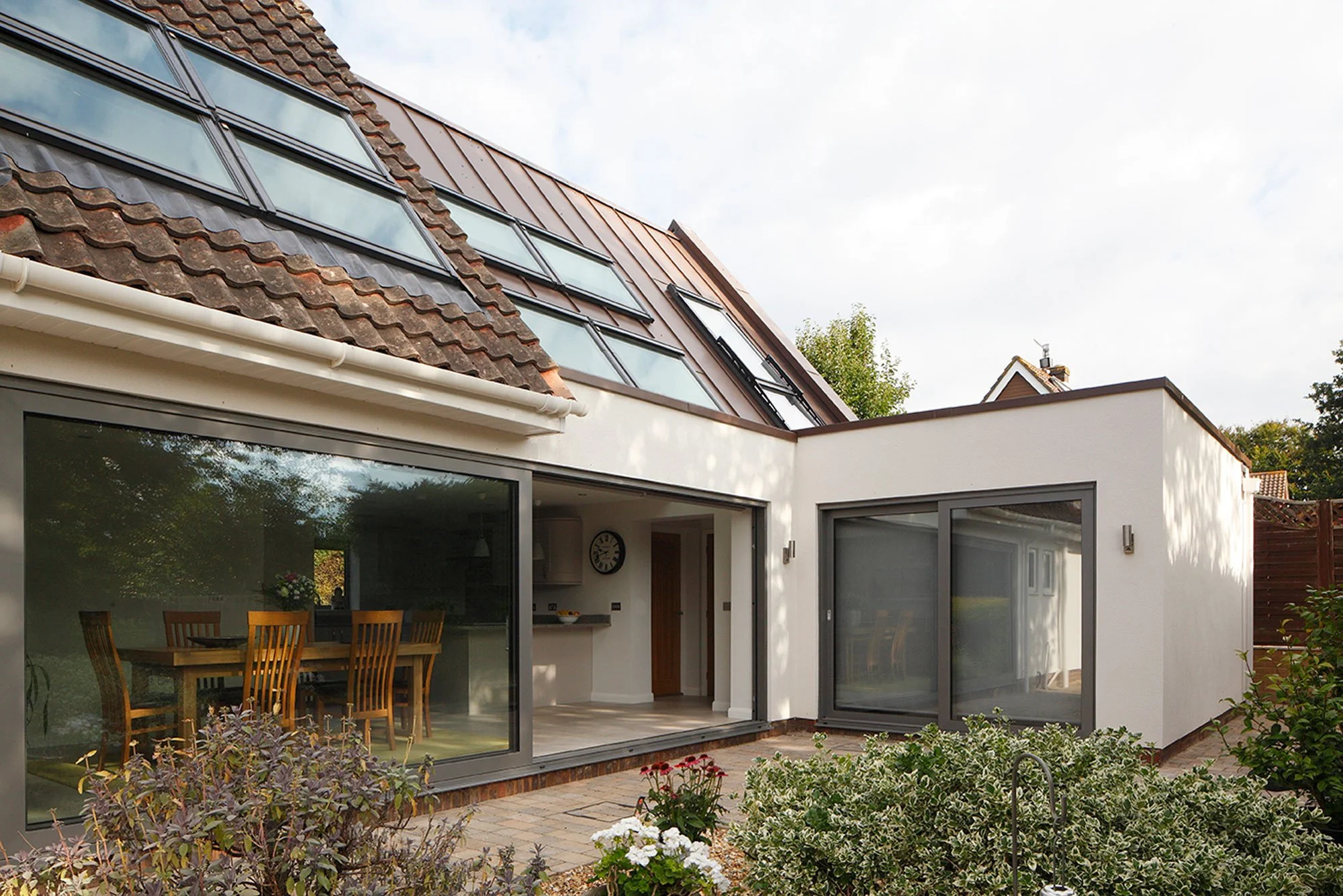 Rear and side extension external showing dining area and rooflights - Marjoram Architects 9 Down Barn Close Project