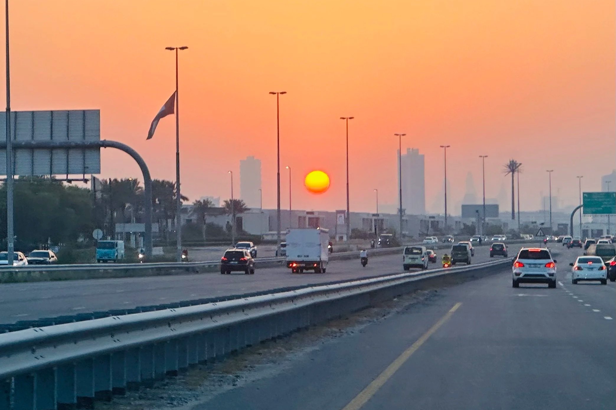 Sunset on a Dubai highway, transitions and goodbyes for internationally mobile families