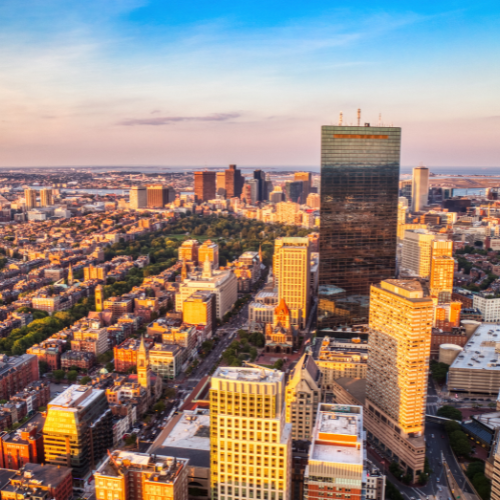 Aerial view of Boston skyline with city buildings and streets during golden hour
