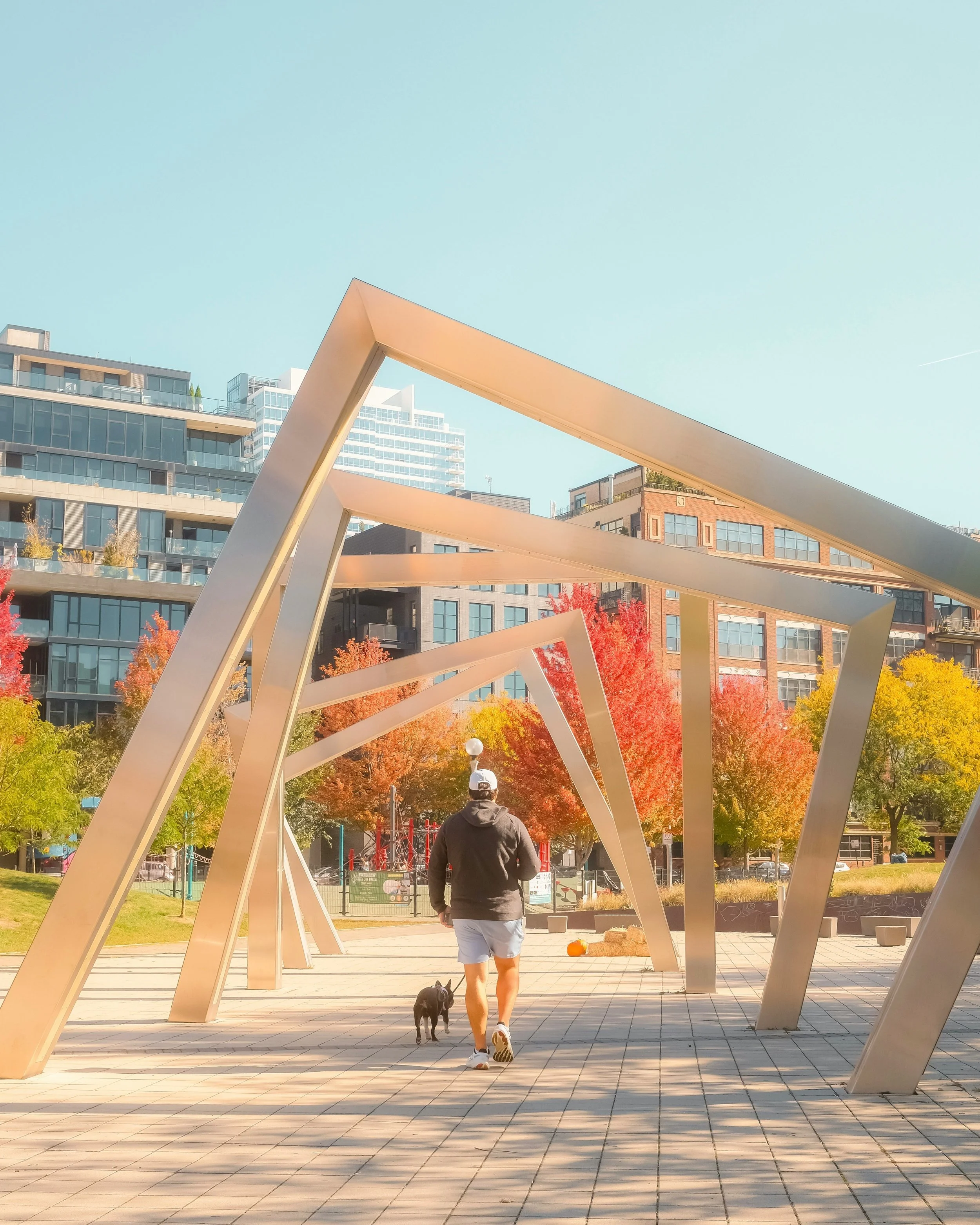 Turning squares sculpture at Mary Bartelme Park in the West Loop in Chicago. Dreamy scene of West Loop with vibrant fall colors.