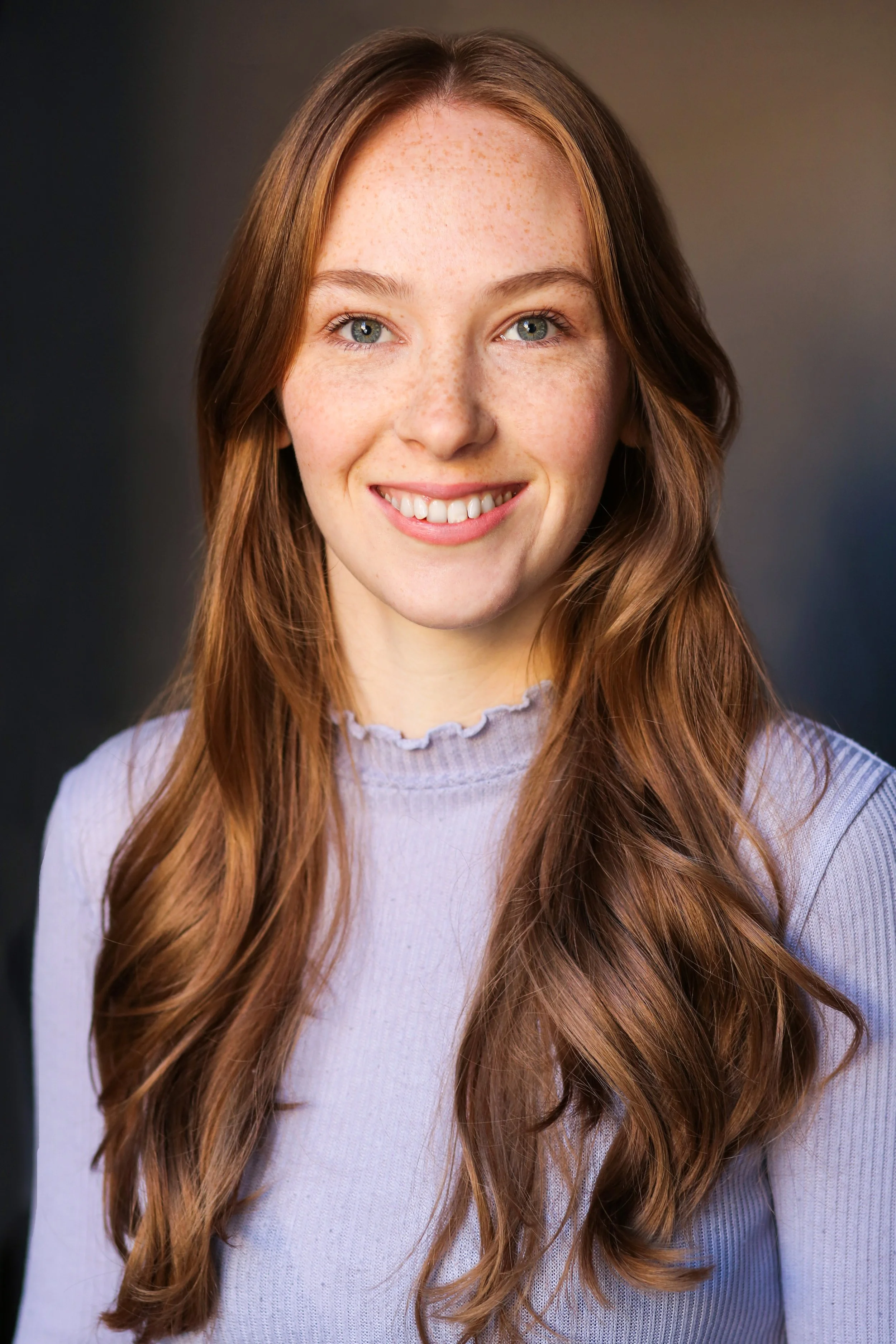 Close-up headshot of Bryony Robinson wearing a ribbed lilac top for Gentle Night