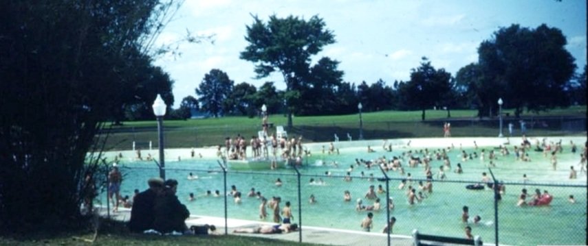 People swimming in City Park Public Pool (1950)