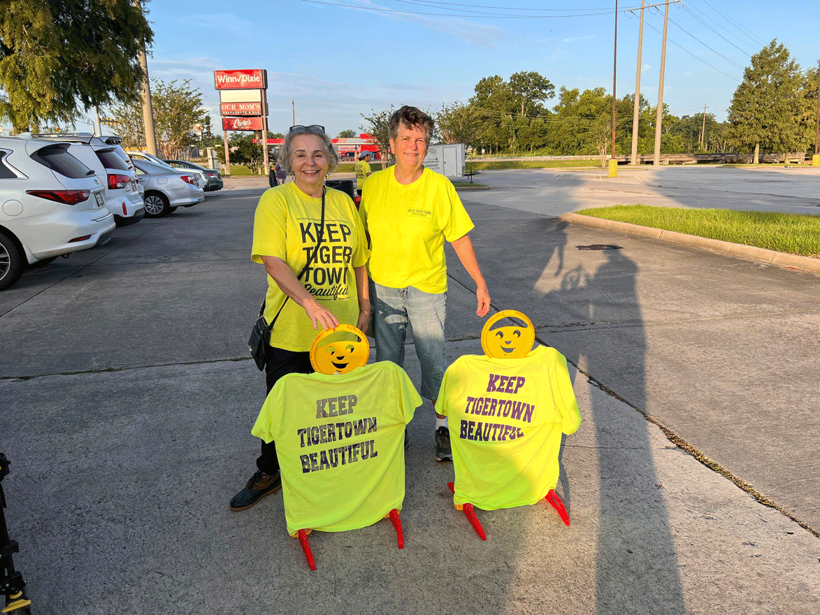  Jennifer Richardson and Debbie Carbo stand with their Keep Tiger Town Beautiful “children.” They put these Kids at Play signs out covered with Keep Tiger Town Beautiful T shirts during Popups to raise awareness for their group. 