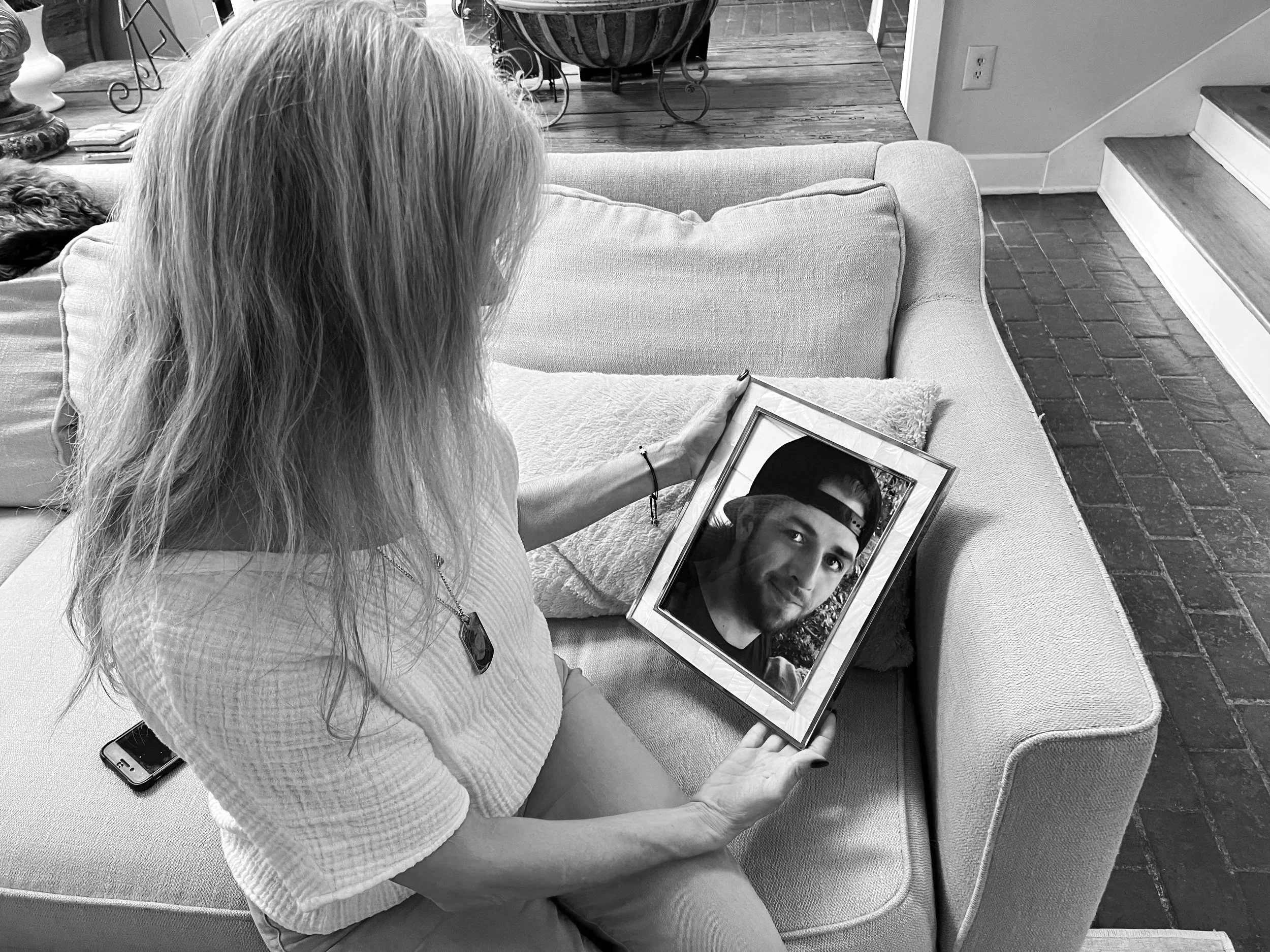 Cheryl Leggio with a photo of her son, Ryan, whose story was featured in “The Addict,” part three of The Fentanyl Project.