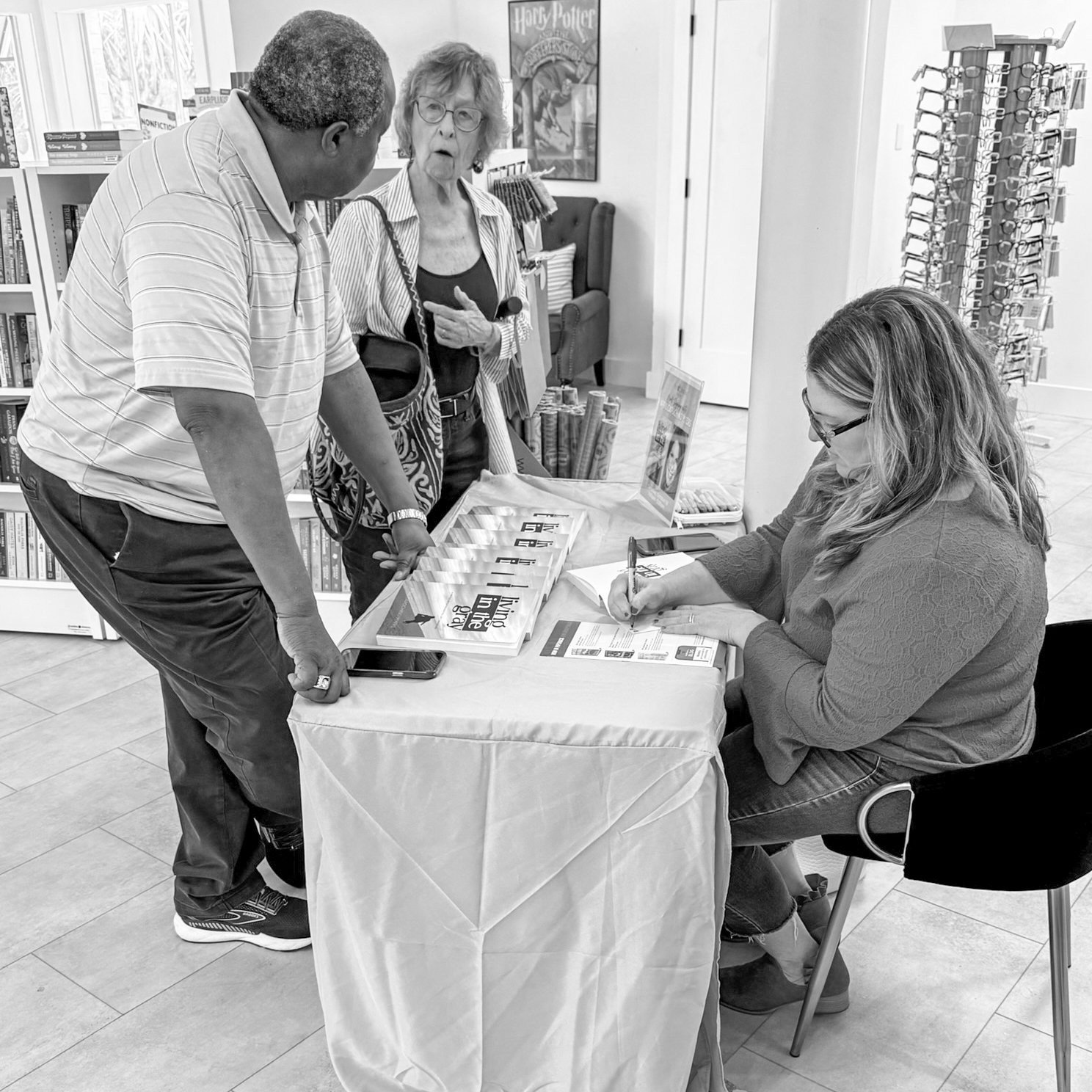 April Capochino Myers speaking with readers at a book signing