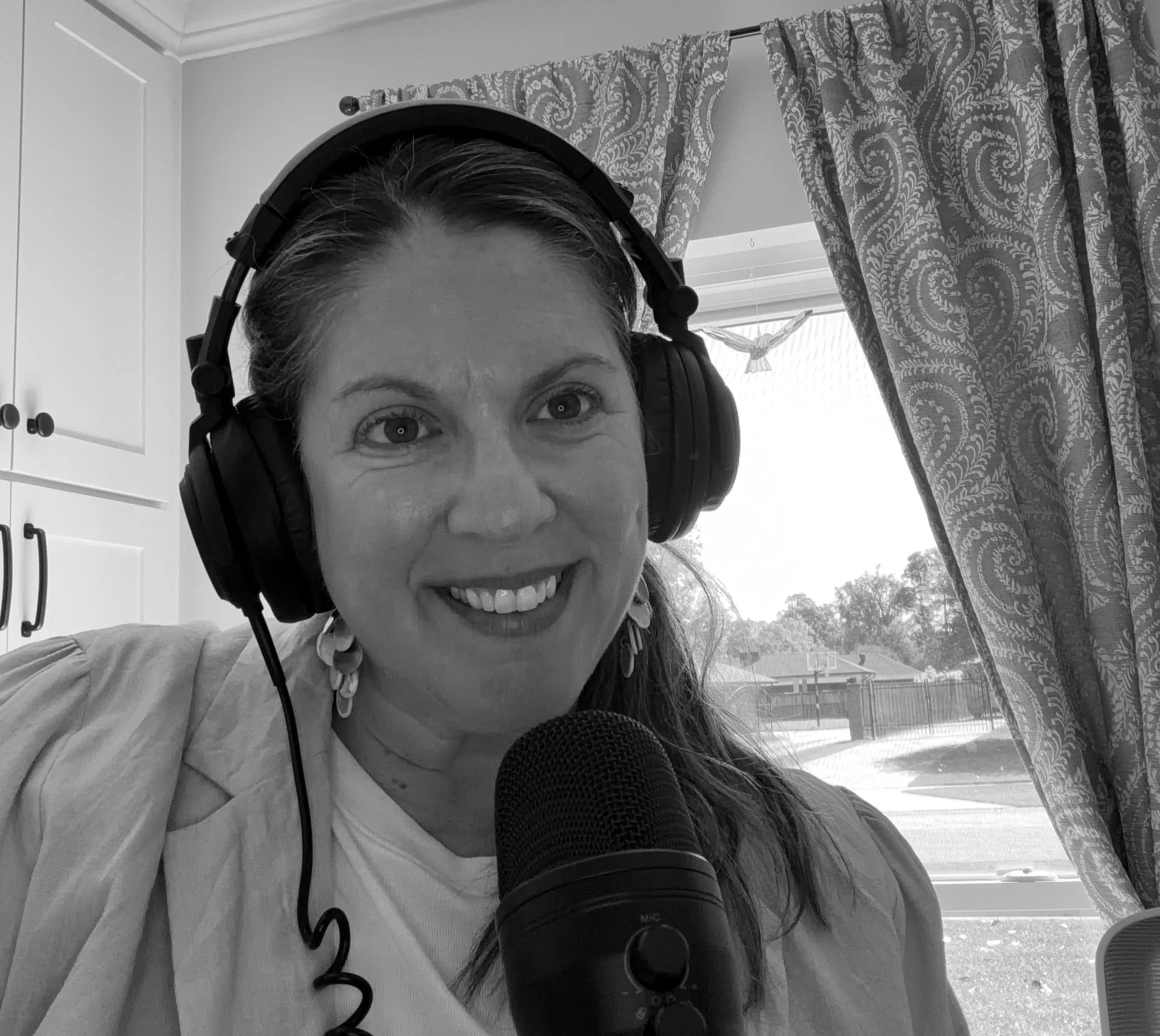 April Capochino Myers recording the Living in the Gray podcast
