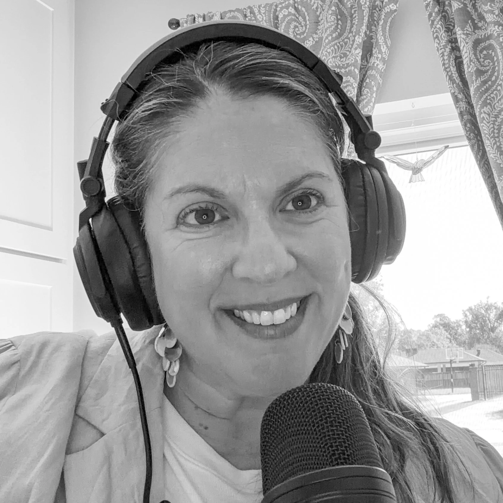 April Capochino Myers recording the Living in the Gray podcast