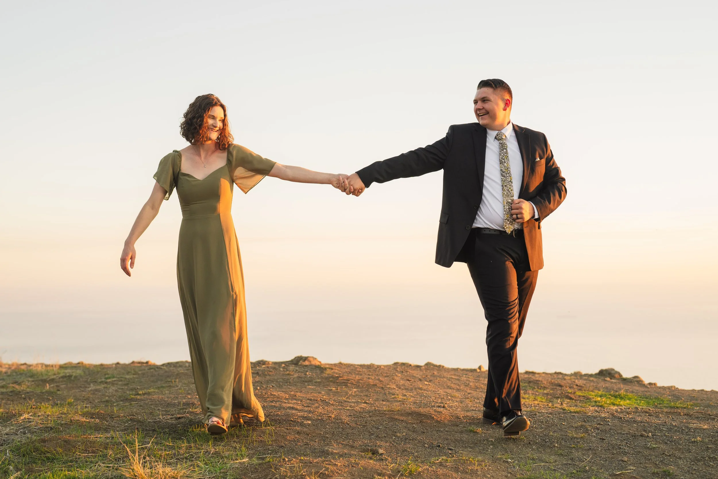 couple walking over the hillside of mount tamalpais coming closer and further from each other